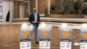 Man in a dark blazer walking in a virtual studio 