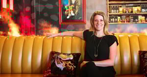 Laura Sullivan, virtual production consultant, sitting on a sofa. 