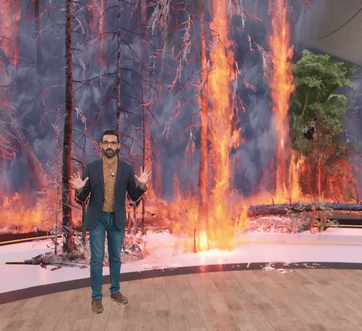 Moderator standing in the virtual studio created by Pixotope software