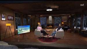 Two women sitting during the talk show in a virtual studio