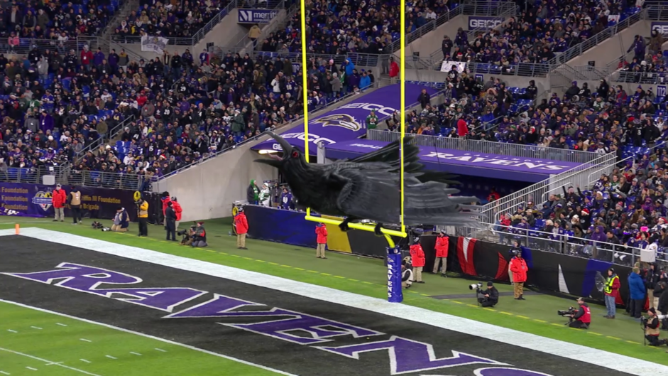 Giant black AR raven sitting above a filled stadium